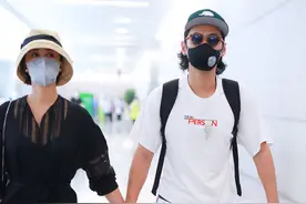 张歆艺、袁弘夫妇现身机场，一白一黑很搭配，走出老夫老妻既视感图片