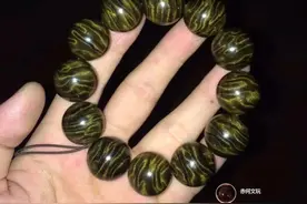 低调中彰显奢华，大气中平淡温雅，雅安金丝楠阴沉木绿料爆满龙胆图片