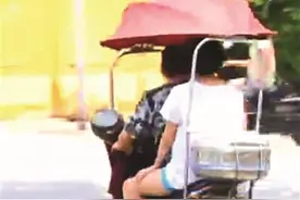 事故频发,电动车遮阳篷依旧满街跑无处罚规定，交警很无奈图片