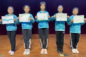 “手拉手检爱同行 心连心共护未来”主题活动之法治手抄报展示图片
