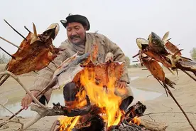 罗布淖尔捕鱼人图片