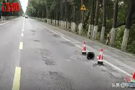 投资近千万新修国道一个月就"破相" 新干县公路局修复路面图片