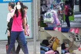 霍启刚街头发口罩，与粉丝进行合照时，小细节更体验修养图片