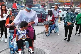 共享单车“车筐装人”如此“共享”让人揪心图片