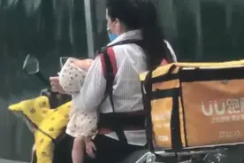 郑州女跑腿员带4个月宝宝送单图片