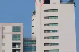 旅游胜地的海滨公寓，31楼外墙悬挂一具外籍男尸！身上有刀伤和枪伤……图片