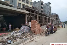 南宁昆仑大道旁有人违规建房，城管出手也不行？部门回应图片