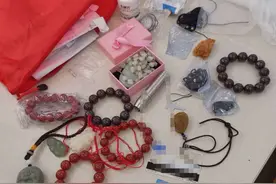一行李箱玉石扔在候车室 男子吃完饭回来傻眼了图片