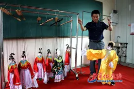 赖家麒：守住非遗木偶戏图片