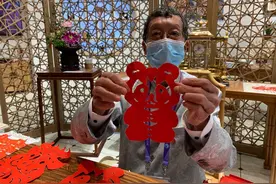 一分钟变出“进宝”！古朴撕纸非遗惊艳进博会图片