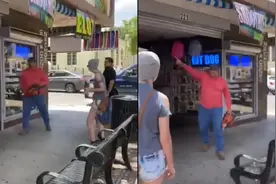 阻止抗议新姿势——手持电锯，与抗议者对峙图片