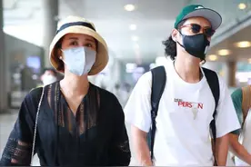 张歆艺瘦身太难，穿长裙走机场掩盖严实，老公留长发小腿比她还瘦图片