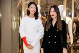 07年拿下世界小姐冠军，成中国第一人，斜肩白裙，气质优雅高贵图片