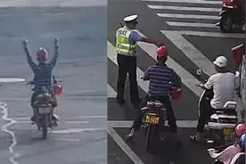 骑摩托男子当交警面双手离把过十字路口 交警：罚款200元扣2分视频封面