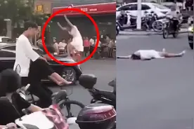 广东湛江一女子在闹市拦车攻击路人，四脚朝天躺地上视频封面