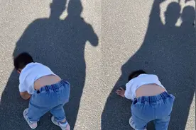 2岁萌娃哭闹趴地上不起，爸妈淡定围观还比个心！一细节网友大赞视频封面