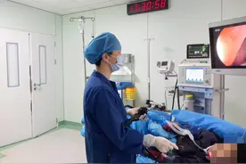9岁男孩误吞一角硬币卡住食管，多学科团队无创取物化险为夷图片
