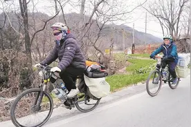 母子从上海骑行14天回黄冈过年 气温4℃仍在路边露营 儿子直呼这次经历“很爽”图片
