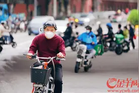 广州海珠区车水马龙，街头行人增多图片